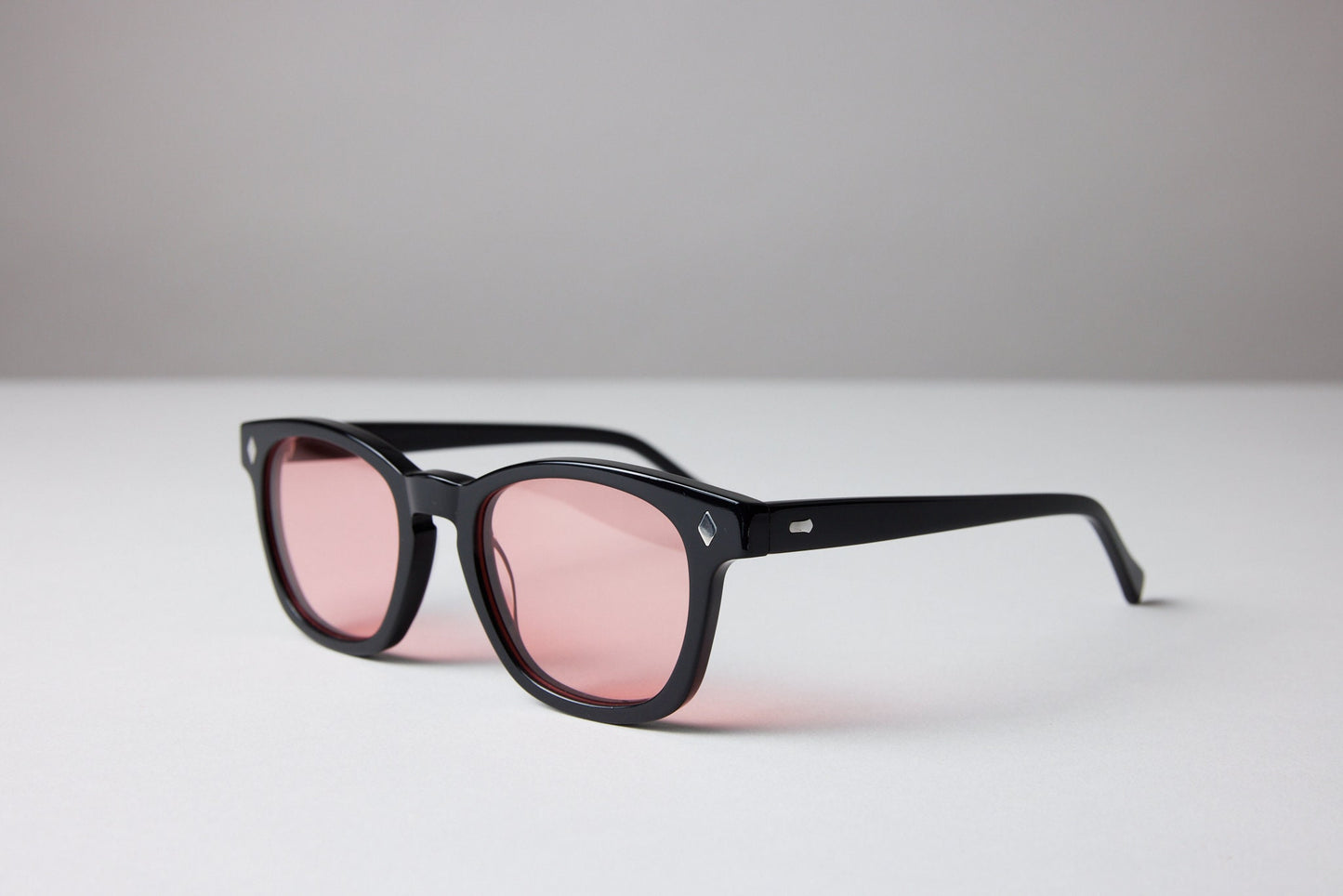 NEW YORK EYERISH, Castlerock. Black Frame with Rose Colored Lenses
